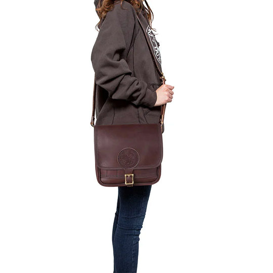 Leather Mini Haversack in rich American cowhide leather worn crossbody, showcasing durable craftsmanship by Duluth Pack for rugged outdoor use.