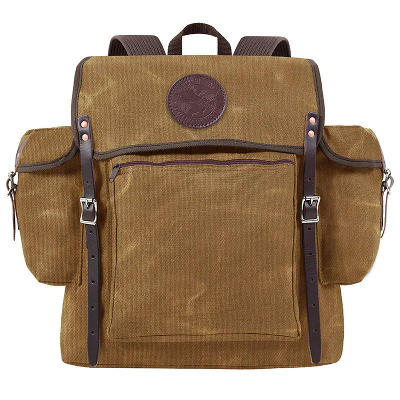 Rambler backpack in waxed khaki canvas with leather straps, designed by Duluth Pack for durable outdoor use and rugged adventures.