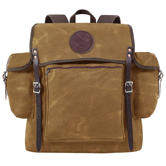 Rambler backpack in waxed khaki canvas with leather straps, designed by Duluth Pack for durable outdoor use and rugged adventures.