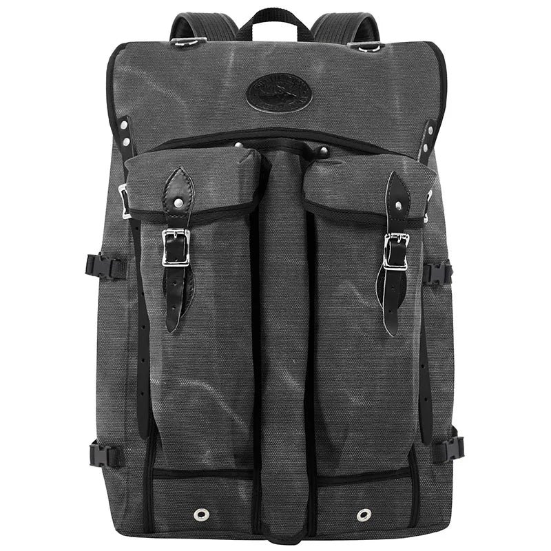 Bushcrafter outdoor backpack in rugged gray waxed canvas with leather straps, designed for durable outdoor use and crafted for dependable performance.