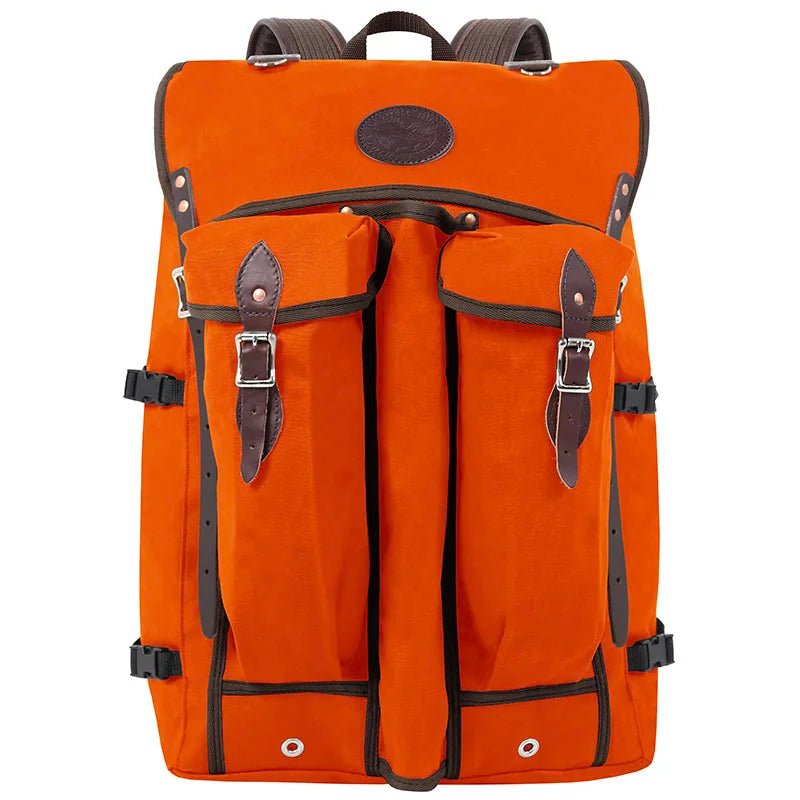Bushcrafter backpack in rugged orange 15-ounce canvas with leather trim, designed for durable outdoor use and low-profile carry by Duluth Pack.