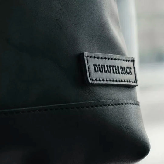 Superior Series Leather Lakewalk Tote in premium black leather, showcasing durable craftsmanship and embossed Duluth Pack logo for rugged everyday use.