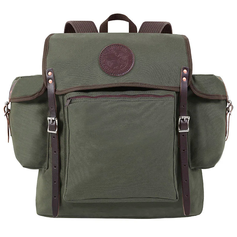 Rambler backpack in Olive Drab canvas with leather straps, featuring durable construction and multiple pockets for outdoor use by Duluth Pack.