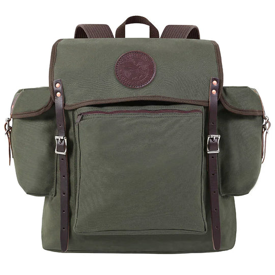 Rambler backpack in Olive Drab canvas with leather straps, featuring durable construction and multiple pockets for outdoor use by Duluth Pack.