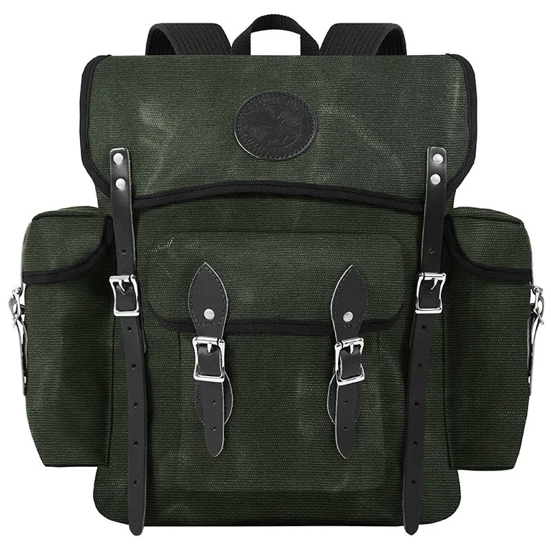 Wanderer backpack in Olive Drab with handmade canvas and leather straps, designed for rugged outdoor use and durable performance by Duluth Pack.