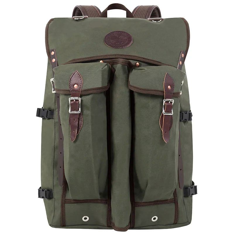 Bushcrafter backpack in rugged olive green 15-ounce canvas with leather straps, designed by Duluth Pack for durable outdoor use and low-profile performance.