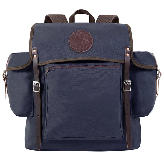 Rambler backpack in navy with leather straps and buckles, featuring durable handmade canvas for rugged outdoor use by Duluth Pack.