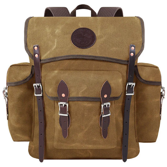Wanderer in waxed khaki rugged canvas with hand-cut leather reinforcements, designed for durable outdoor use by Duluth Pack.