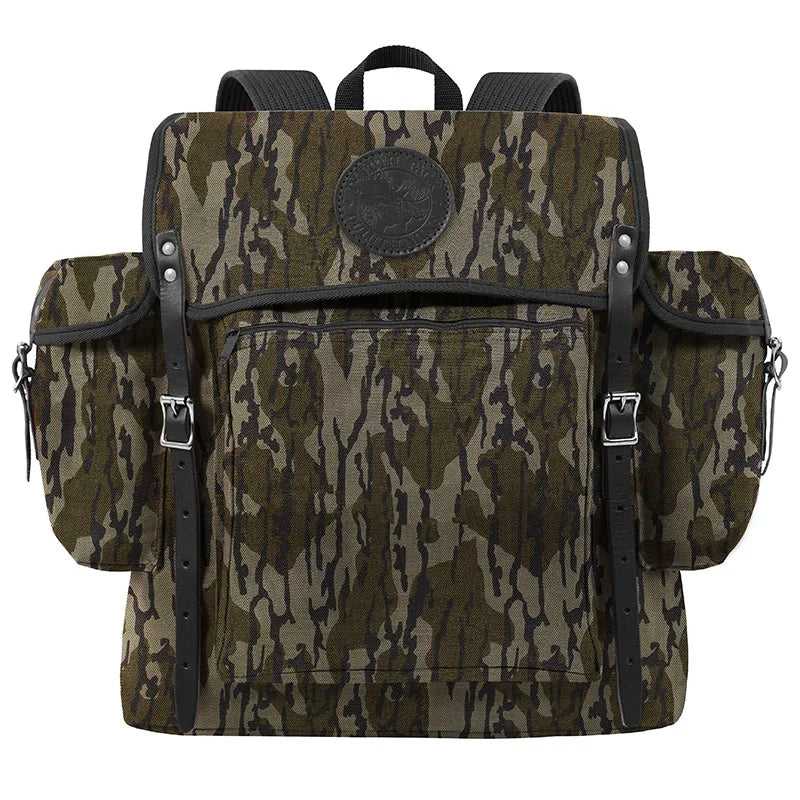 Rambler backpack in Mossy Oak Bottomland Camo with tough canvas and leather straps, designed by Duluth Pack for durable outdoor use.