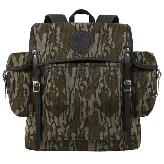 Rambler backpack in Mossy Oak Bottomland Camo with tough canvas and leather straps, designed by Duluth Pack for durable outdoor use.