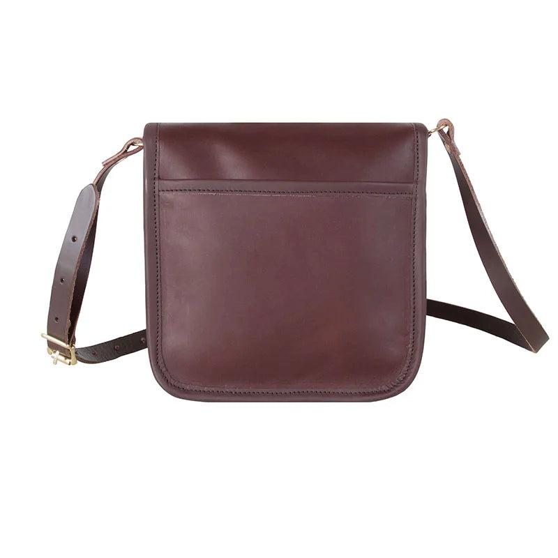 Leather Mini Haversack in premium American cowhide leather with adjustable strap, designed by Duluth Pack for rugged outdoor use and lasting durability.