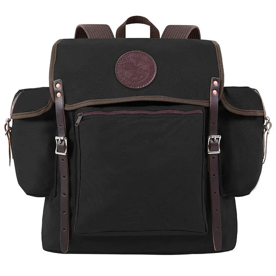 Rambler backpack in black canvas with leather straps and multiple pockets, designed for durable outdoor use and rugged adventures by Duluth Pack.