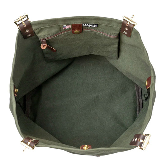 Market Tote in Olive Drab featuring rugged canvas interior with premium leather handles and antique brass hardware, designed for durable outdoor use by Duluth Pack.