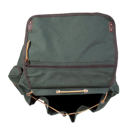 Rambler backpack in Olive Drab canvas with leather accents by Duluth Pack, open to show spacious interior and zippered front pocket, designed for rugged outdoor use.