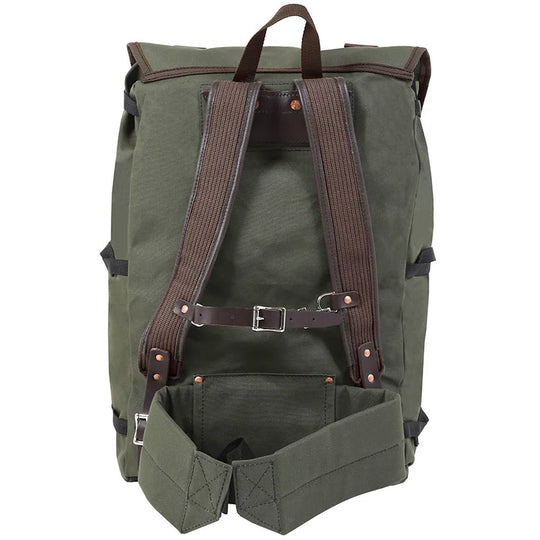Bushcrafter backpack in rugged olive green canvas with brown leather straps, designed by Duluth Pack for durable outdoor adventures.