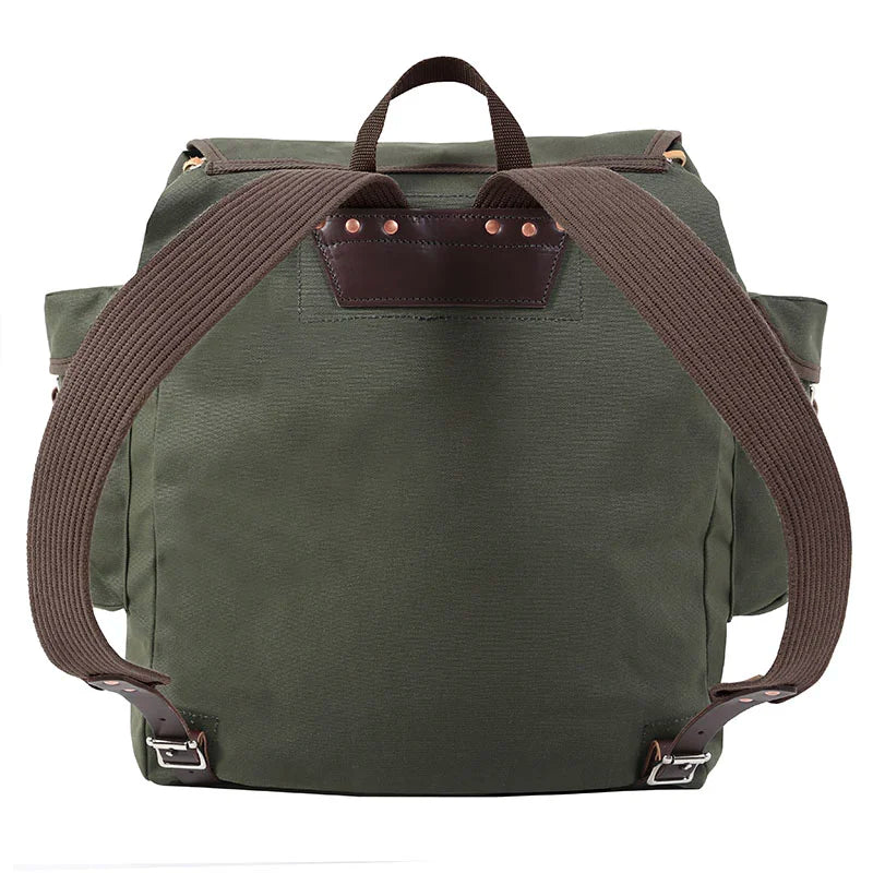 Rambler backpack in Olive Drab with tough canvas construction and leather accents, perfect for outdoor adventures and rugged day trips by Duluth Pack.