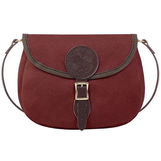 Medium Shell Purse in burgundy with antique brass buckle and leather accents by Duluth Pack, showcasing handmade rugged outdoor craftsmanship and durable canvas.