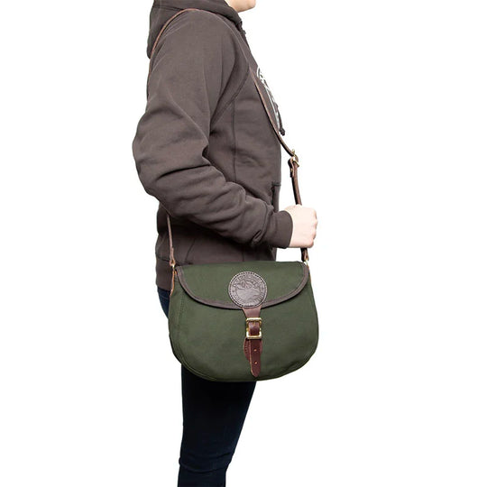 Medium Shell Purse in Olive Drab with handmade leather details by Duluth Pack, shown worn crossbody for durable outdoor use and heritage style.