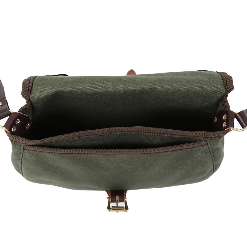Medium Shell Purse in Olive Drab with antique brass hardware, showcasing durable handmade canvas and leather craftsmanship by Duluth Pack for rugged outdoor use.