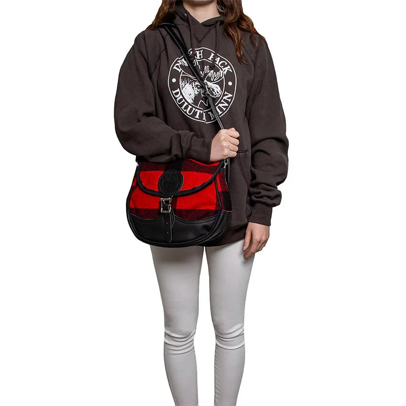 Deluxe Medium Classic Wool Shell Purse in timeless wool and leather, worn by a person in casual outdoor attire, showcasing durable craftsmanship and rugged style.