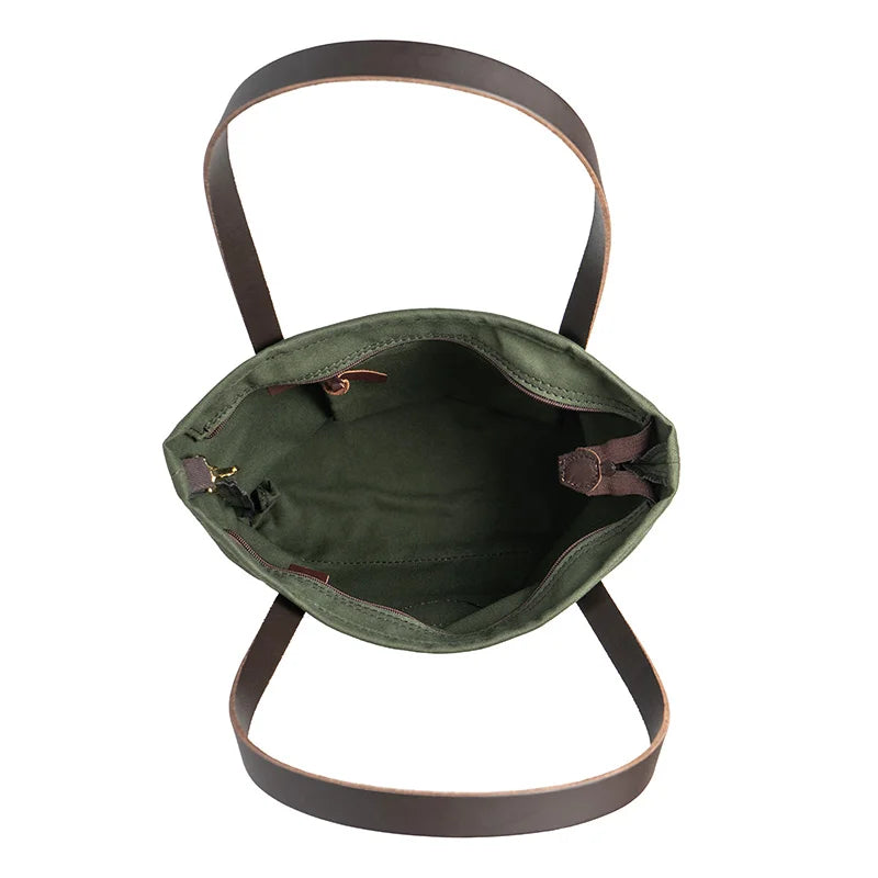 Lakewalk Tote in Olive Drab with riveted leather handles and internal clip, showcasing durable canvas craftsmanship for versatile outdoor and everyday use by Duluth Pack.