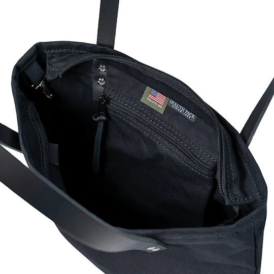 Superior Series Canvas Lakewalk Tote in black canvas with leather straps, showcasing durable craftsmanship and spacious interior for outdoor use by Duluth Pack.