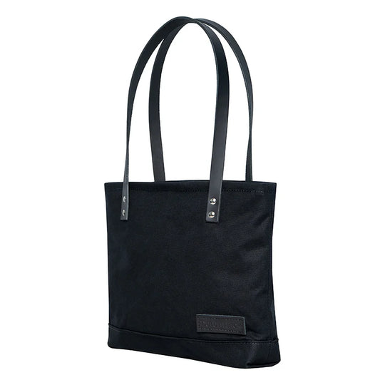 Superior Series Canvas Lakewalk Tote in black canvas with leather handles by Duluth Pack, crafted for durable outdoor use and timeless style.