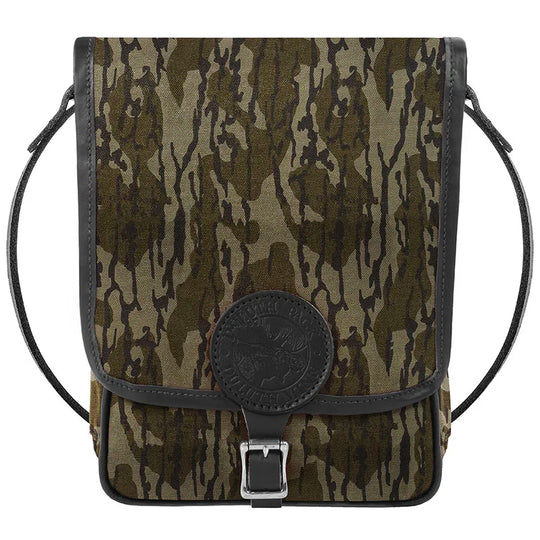 Haversack in rugged camouflage 15-ounce canvas with premium leather accents and durable roller buckle, ideal for outdoor use by Duluth Pack.