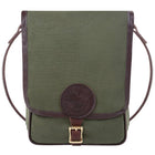 Haversack in rugged olive green 15-ounce canvas with premium leather trim and antique brass buckle, crafted by Duluth Pack for durable outdoor use.
