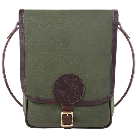 Haversack in rugged olive green 15-ounce canvas with premium leather trim and antique brass buckle, crafted by Duluth Pack for durable outdoor use.