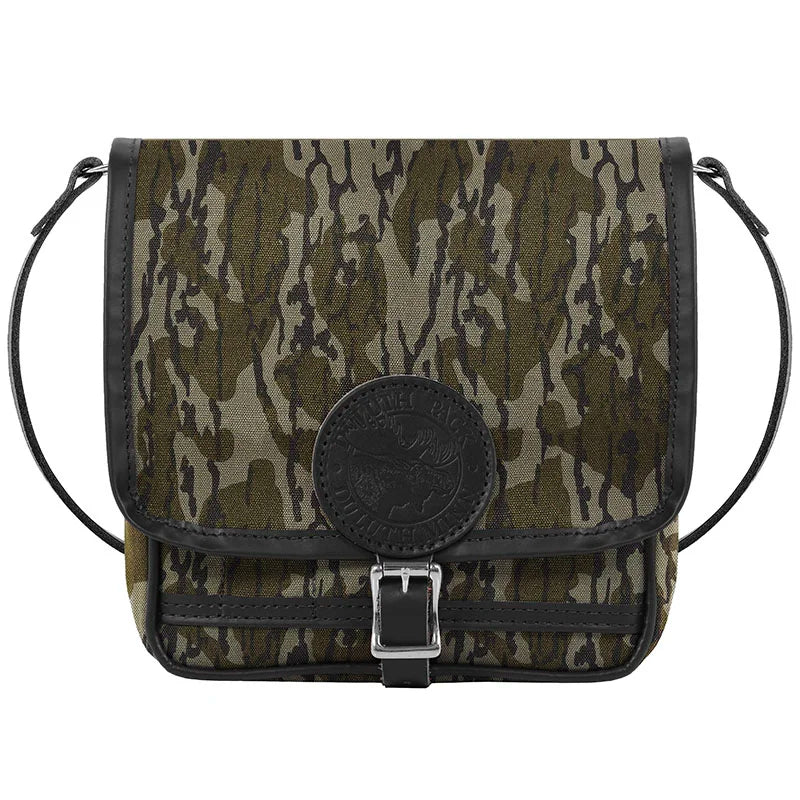 Mini Haversack Purse in Mossy Oak Bottomland Camo canvas with leather trim, designed for rugged outdoor use and durable everyday travel gear.