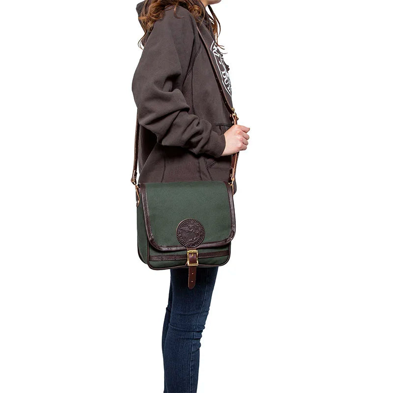Mini Haversack Purse in Olive Drab with premium leather accents, worn crossbody by a person in casual outdoor attire, showcasing its rugged everyday style.