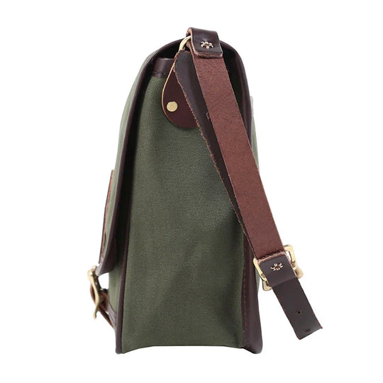 Mini Haversack Purse in Olive Drab featuring rugged canvas and premium leather with antique brass hardware, designed for everyday travel and outdoor use.