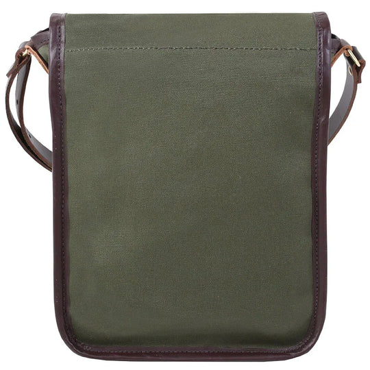 Haversack in rugged olive green 15-ounce canvas with premium leather trim and adjustable strap, designed for durable outdoor use by Duluth Pack.