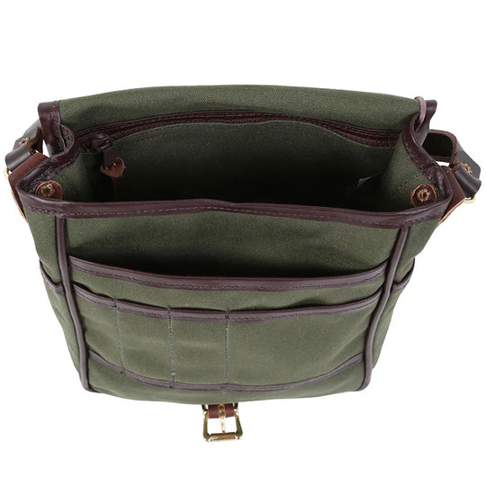 Haversack in rugged 15-ounce canvas with premium leather trim and antique brass hardware, designed for durable outdoor use by Duluth Pack.