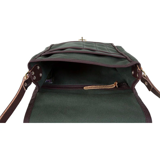 Haversack in rugged 15-ounce canvas with premium leather straps and antique brass hardware, showcasing durable handmade outdoor gear craftsmanship by Duluth Pack.