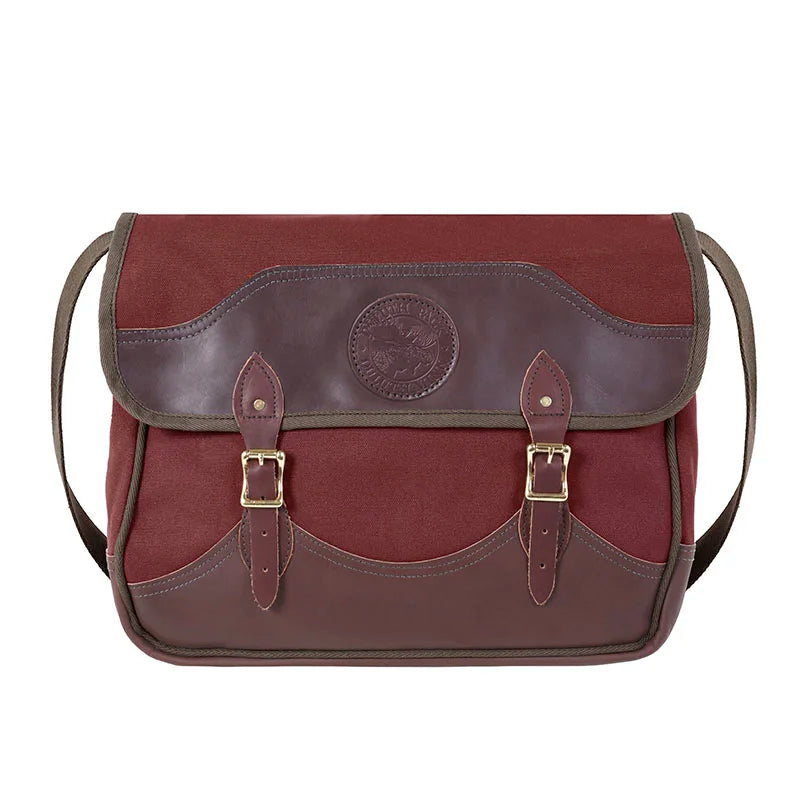 Deluxe Book Bag in Burgundy with handcrafted leather trim and antique brass hardware, designed for rugged outdoor use by Duluth Pack.