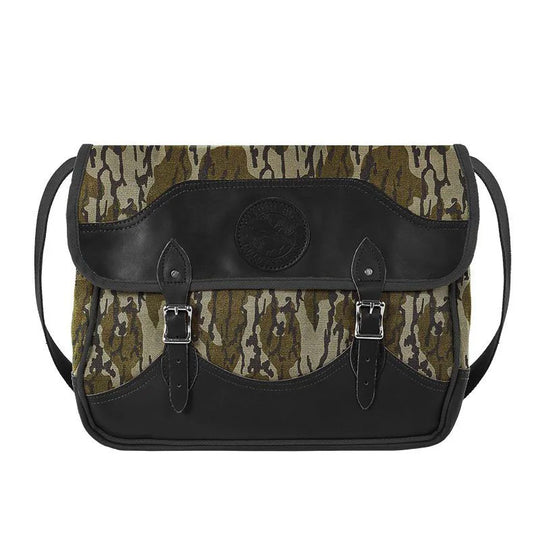 Deluxe Book Bag in Mossy Oak Bottomland Camo with handcrafted leather trim, durable rugged canvas, and adjustable shoulder strap, ideal for outdoor use.