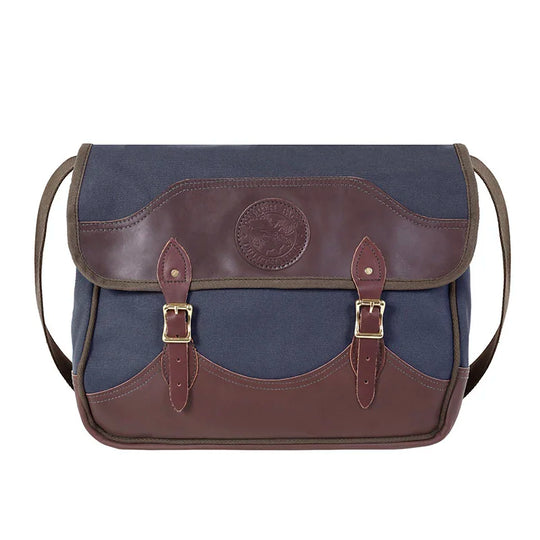 Deluxe Book Bag in navy with handcrafted leather trim and durable brass hardware, showcasing heritage craftsmanship ideal for rugged outdoor use.