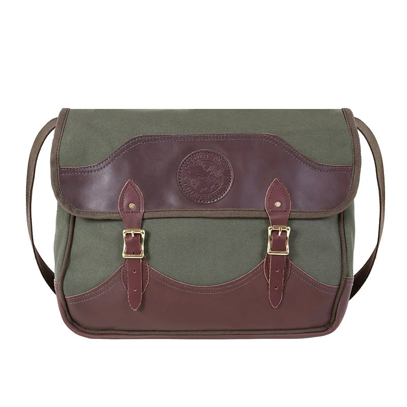 Deluxe Book Bag in Olive Drab with handcrafted leather trim and antique brass hardware, a durable canvas and leather outdoor gear piece by Duluth Pack.