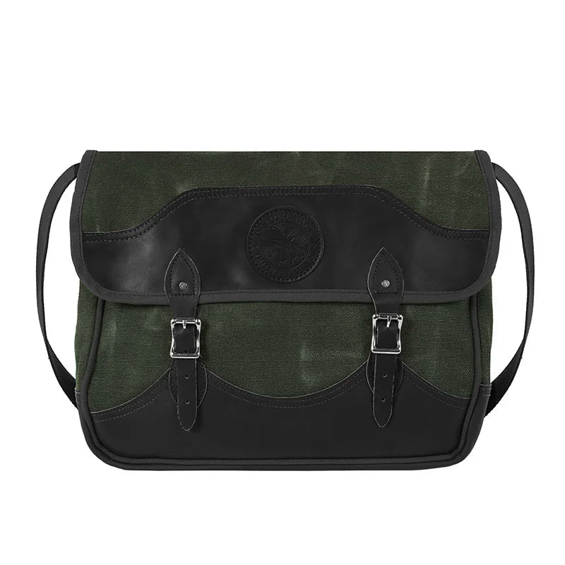 Deluxe Book Bag in olive drab with handcrafted leather bottom and flap trim, sturdy canvas construction, and comfortable cotton web shoulder strap for rugged outdoor use.