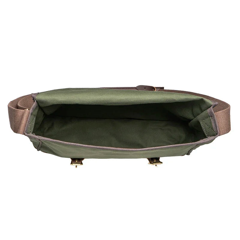 Deluxe Book Bag in Olive Drab with rugged canvas and leather trim, open top view showcasing spacious interior, ideal for outdoor and everyday use by Duluth Pack.