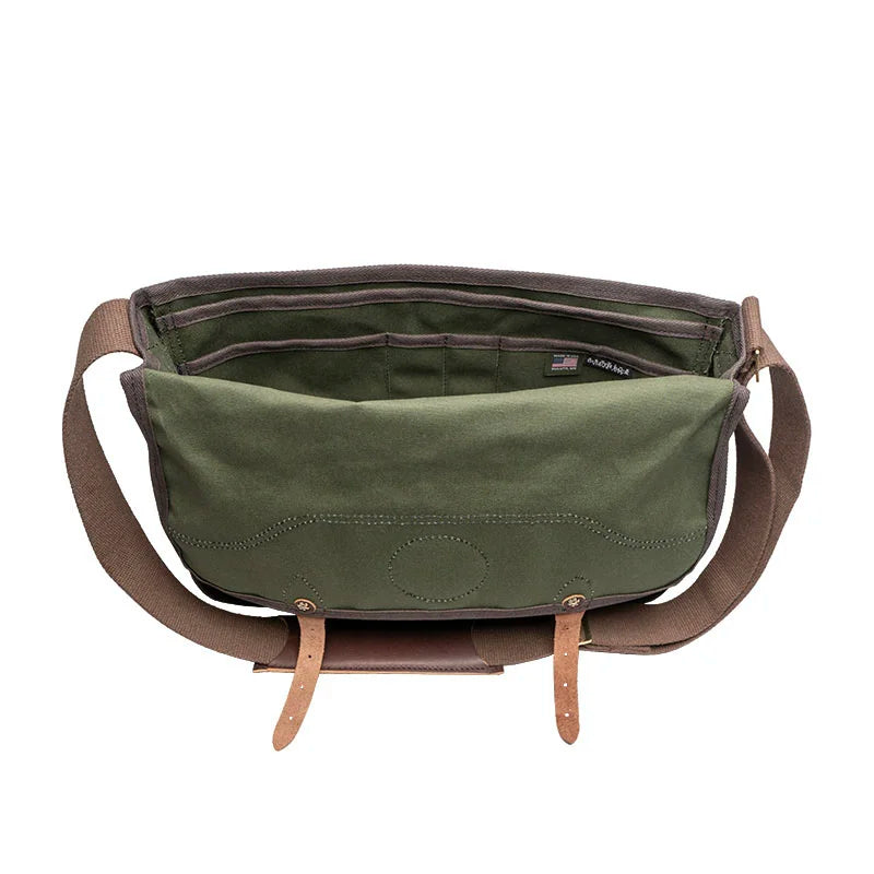 Deluxe Book Bag in Olive Drab featuring rugged 15-ounce canvas and handcrafted leather trim, designed by Duluth Pack for durable outdoor use and timeless style.