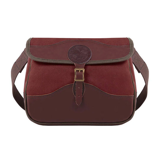 Field Satchel in rich burgundy canvas and leather with antique brass hardware, showcasing durable craftsmanship ideal for outdoor use by Duluth Pack.