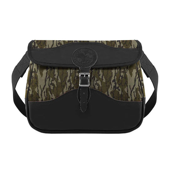 Field Satchel in rugged camo canvas and black leather with brass hardware, designed by Duluth Pack for durable outdoor use and classic craftsmanship.