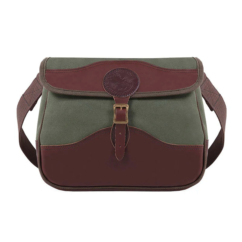 Field Satchel in rugged olive canvas with premium brown leather accents and antique brass hardware, designed for durable outdoor use by Duluth Pack.