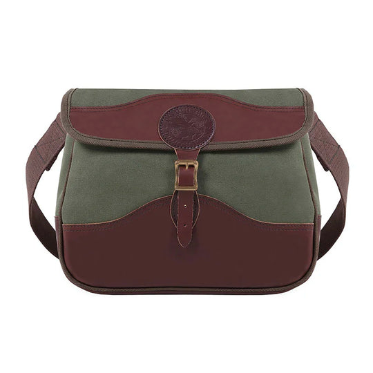 Field Satchel in rugged olive canvas with premium brown leather accents and antique brass hardware, designed for durable outdoor use by Duluth Pack.