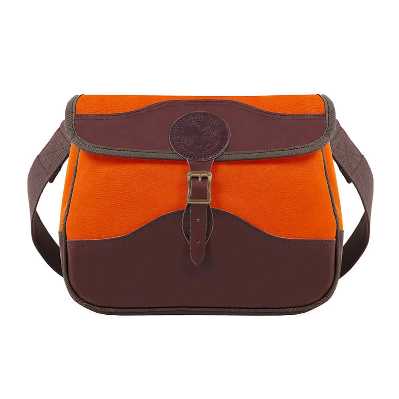 Field Satchel in vibrant orange rugged canvas with thick premium brown leather accents and adjustable web shoulder strap, designed for durable outdoor use by Duluth Pack.
