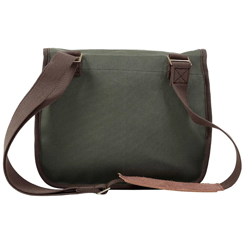 Field Satchel in rugged green 15-ounce canvas with thick premium leather detailing and adjustable web shoulder strap, designed for durable outdoor use by Duluth Pack.