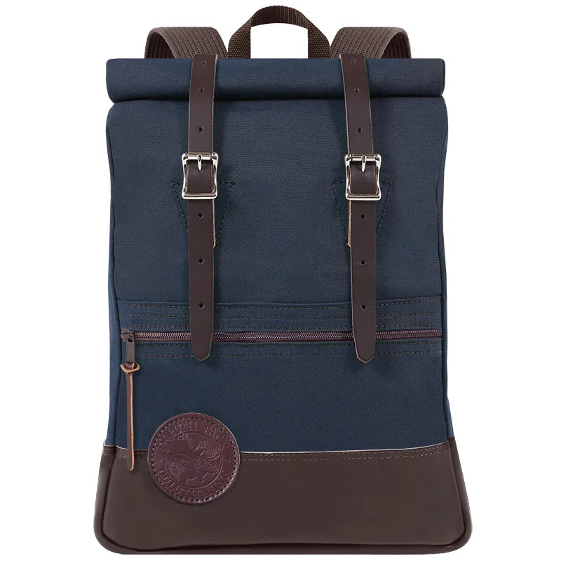 Deluxe Roll-Top Scout Pack in navy with leather accents, handcrafted by Duluth Pack, designed for rugged outdoor use and durable, long-lasting performance.